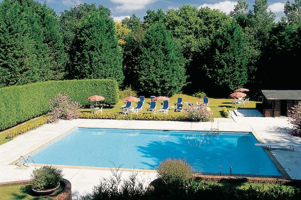 The outdoor swimming pool at Le Manoir Golf Hotel, Le Touquet, France