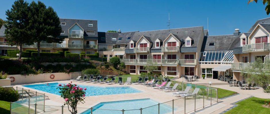 The pool area in the sun at the Mercure Omaha Beach, Port en Bessin, Normandy, France