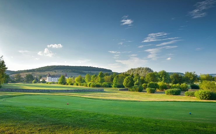 Tee shot view at Golf de Château de Chailly with hills beyond