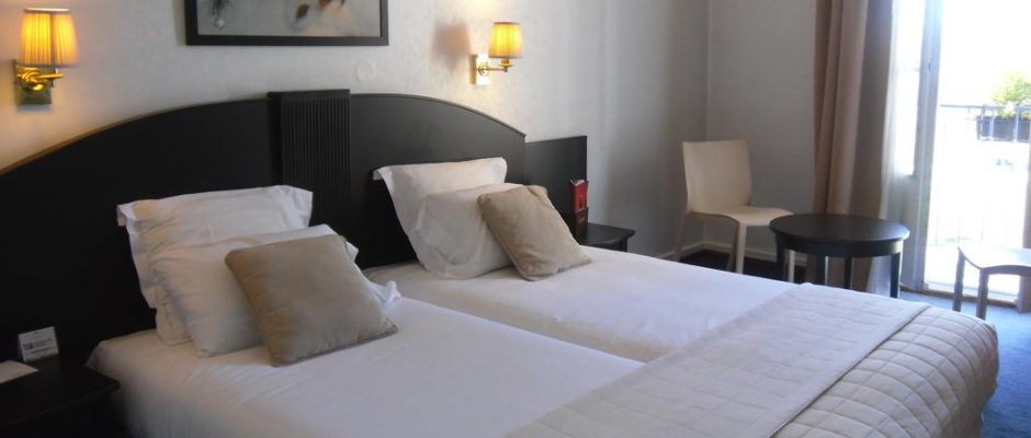 A twin bedroom at Grand Hotel, Strasbourg, France