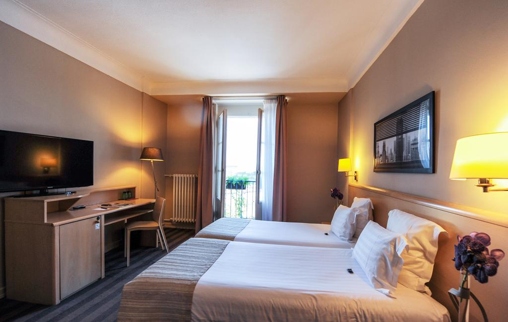 A twin bedroom at Grand Hotel, Strasbourg, France