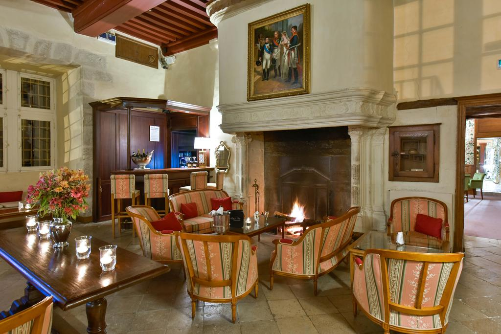 Château de Chailly bar with stone fireplace and timber details