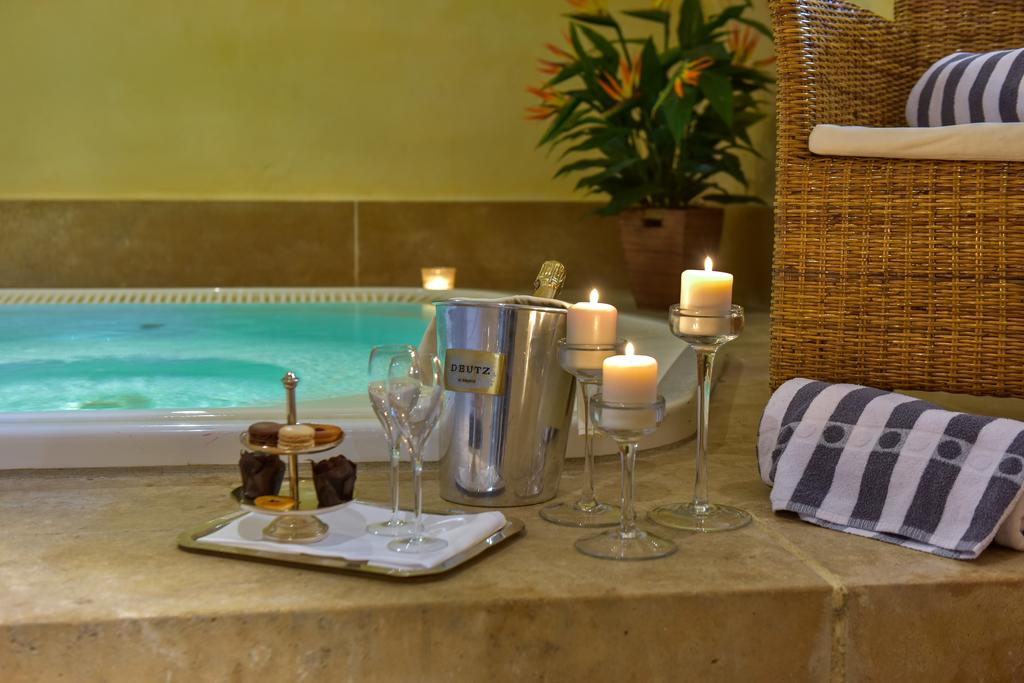 Spa treatment room at Château de Chailly with candles and pool light
