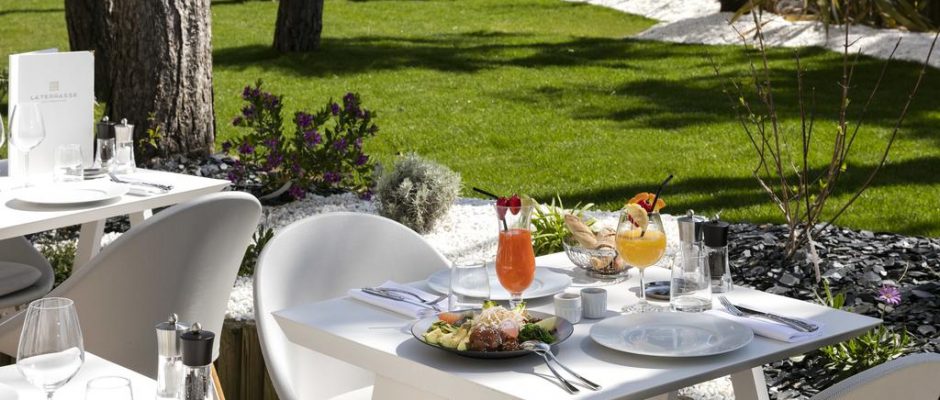 Dine on the terrace at Hotel Barriere lâ€™Hermitage, La Baule, Brittany, France