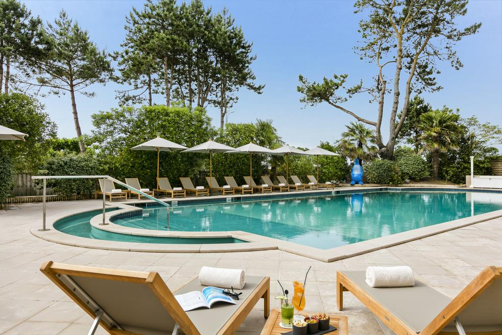 Relax by the pool at Hotel Barriere lâ€™Hermitage, La Baule, Brittany, France