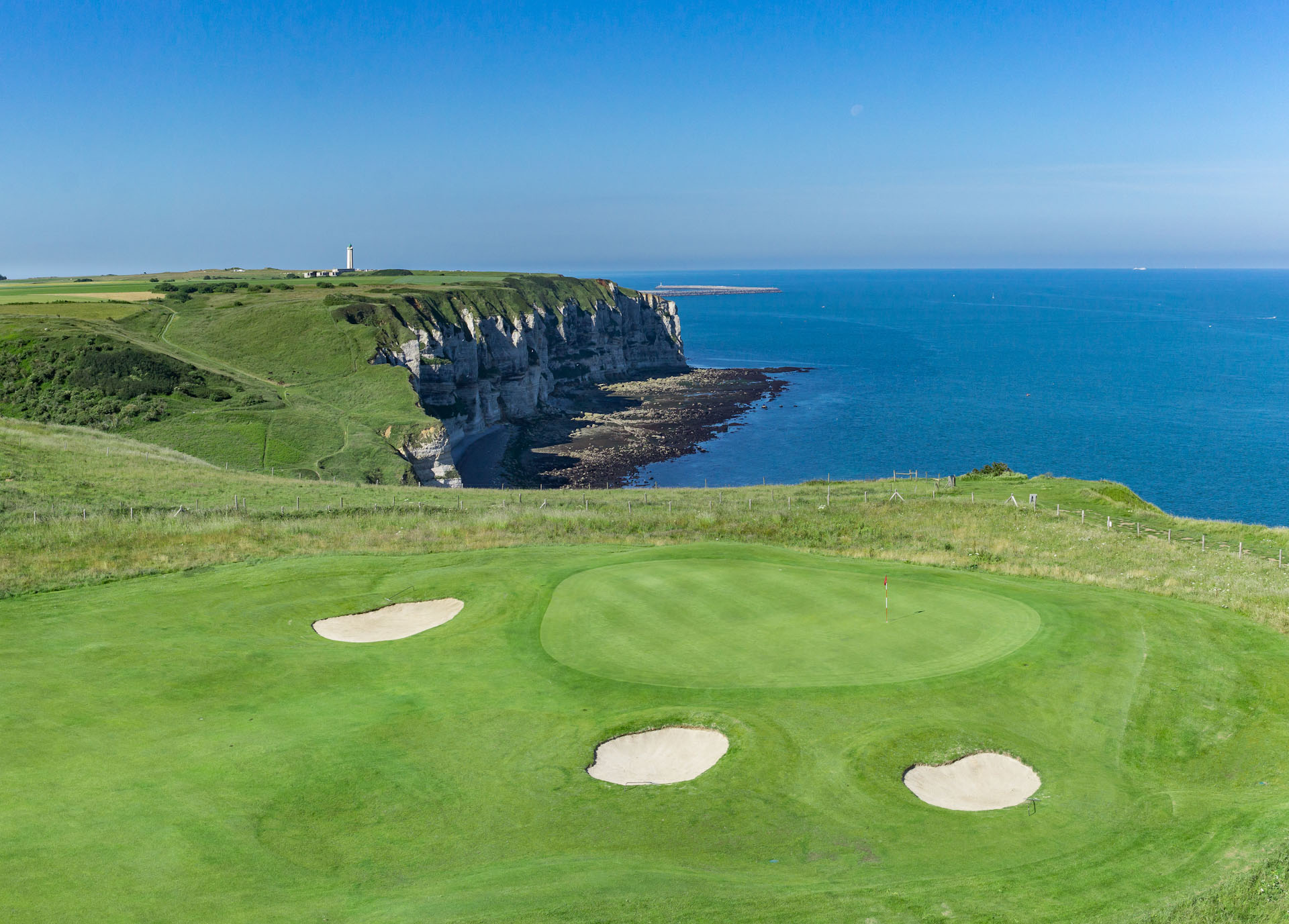 The fourth green and lighthouse at Etretat Golf Club, Normandy, France