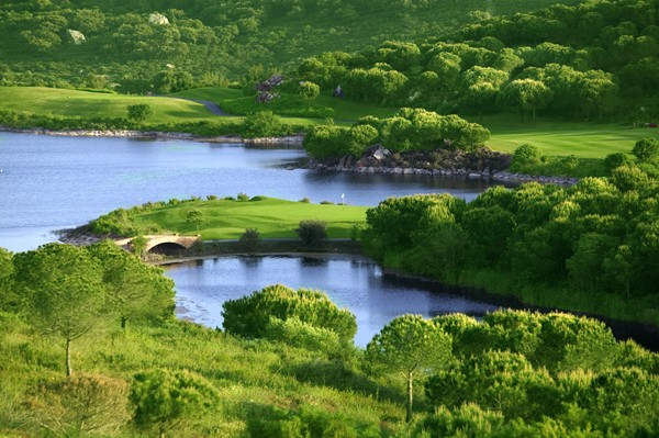 Carry the water at Almenara Golf Course, Costa del Sol, Spain. Golf Planet Holidays
