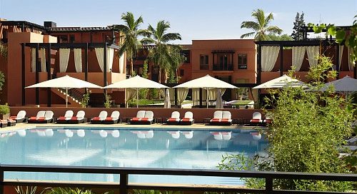 By the pool at Hotel and Ryads Barriere Le Naoura, Marrakech, Morocco