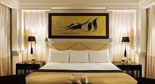 A luxury double bedroom at Hotel and Ryads Barriere Le Naoura, Marrakech, Morocco