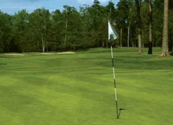 On the green at Wentworth Club Edinburgh Golf Course, Surrey, England. Golf Planet Holidays
