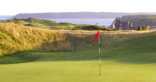On the green at Pennard golf club Golf Course, Swansea, Wales. Golf Planet Holidays.