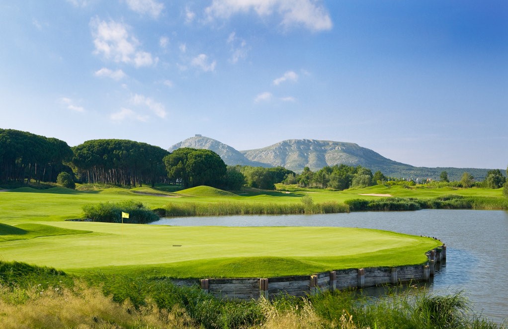 Go over the water or take the longer route round on the ninth hole of Emporda Forest golf course, Costa Brava, Spain