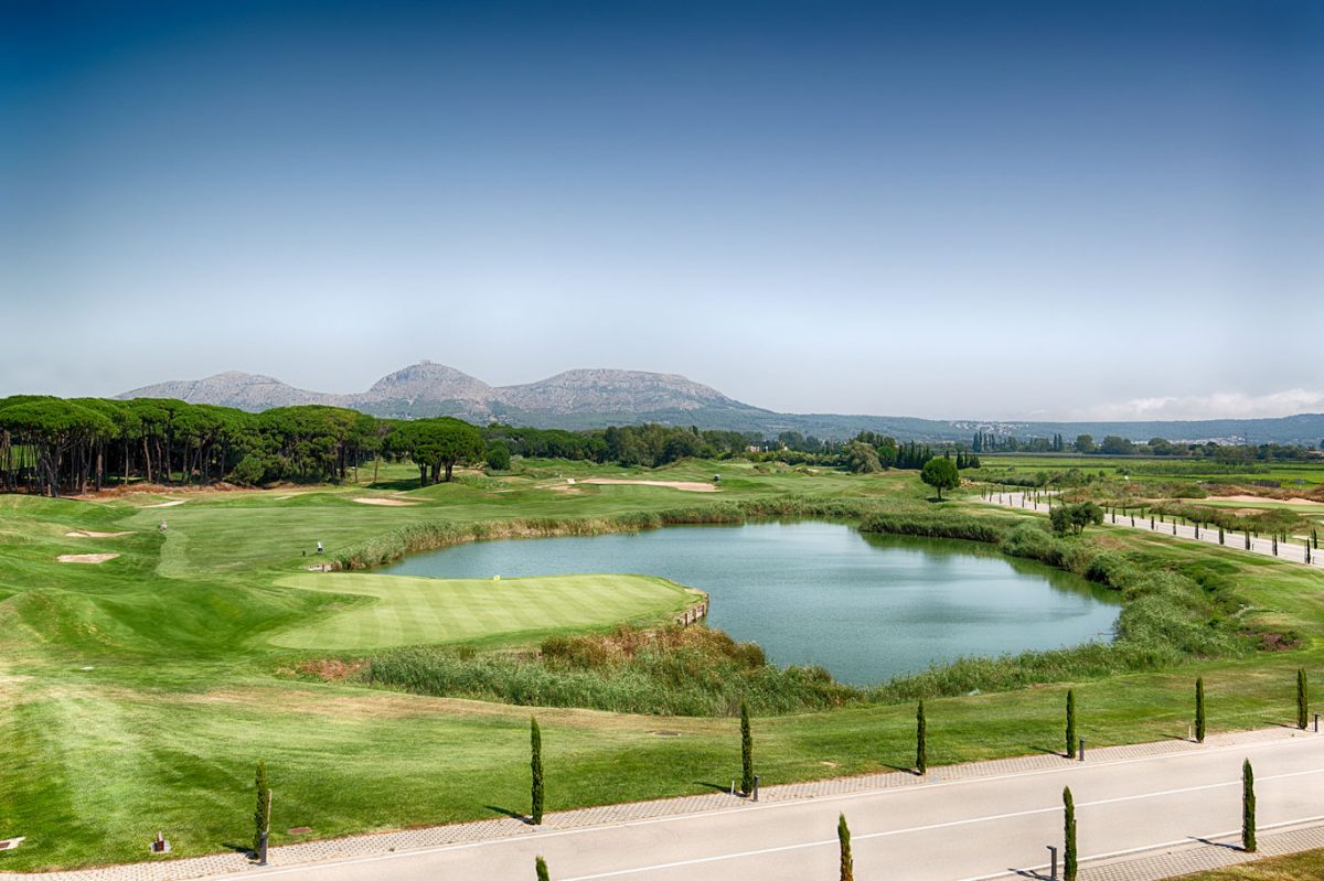 Head over the water to the green at Emporda Golf Course Girona, Costa Brava, Spain