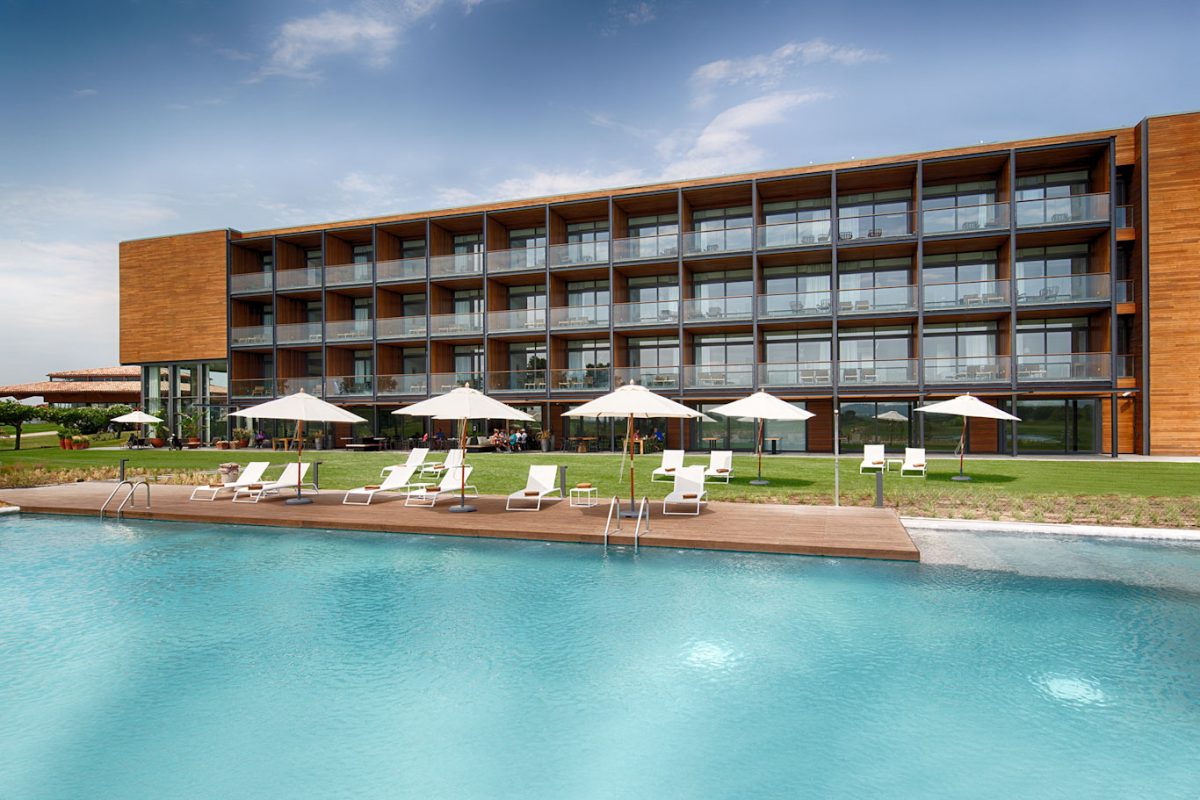 Swim in the outdoor pool at Hotel Emporda Golf Girona