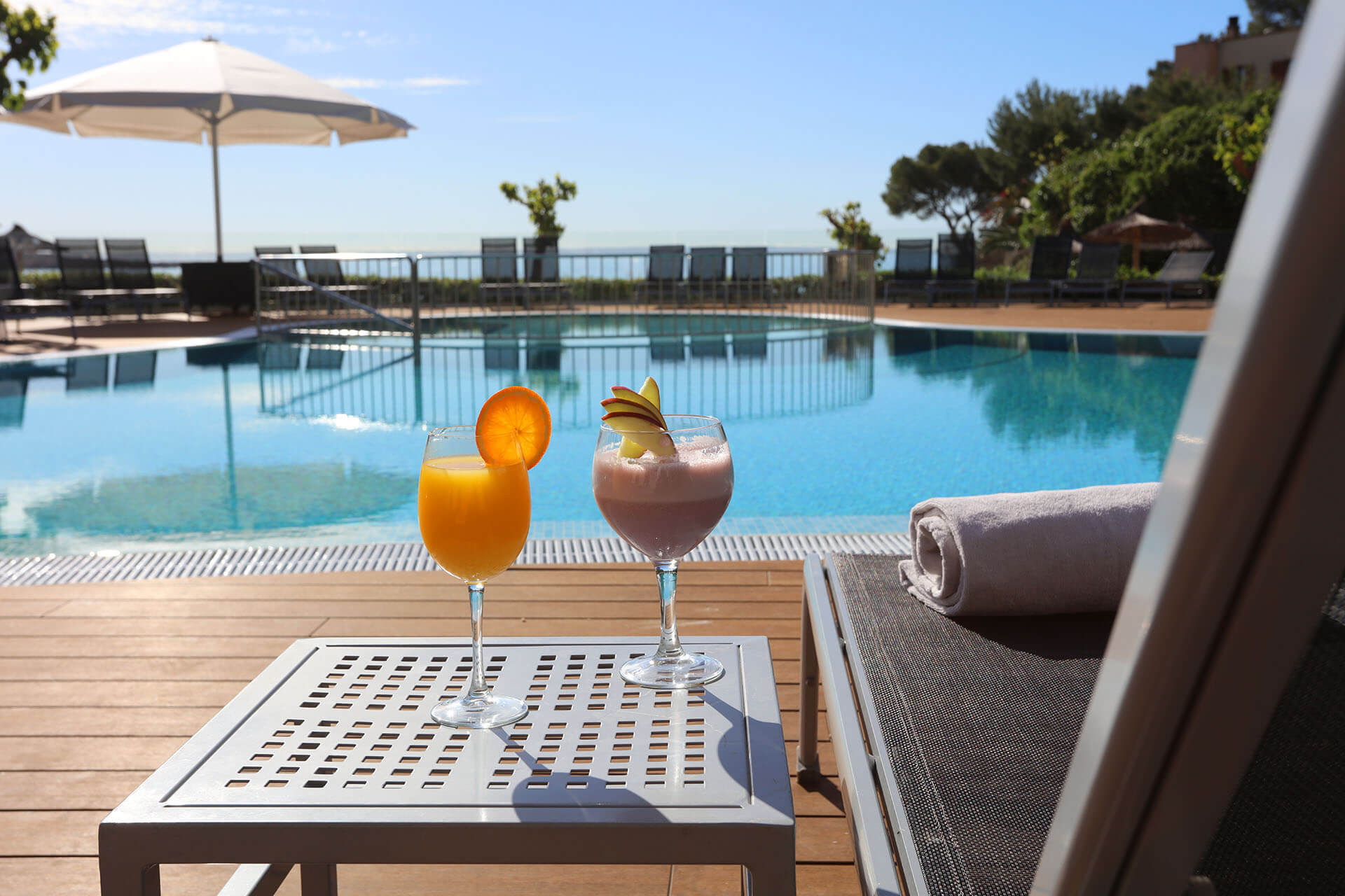 Cocktails by the outdoor pool at Son Caliu Spa Oasis Hotel, Mallorca