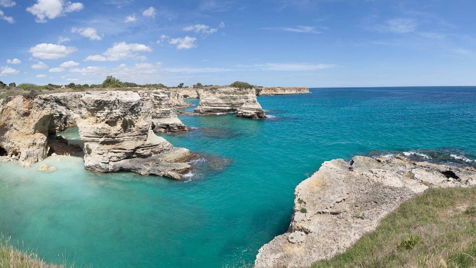 The Salento coastline near Acaya Golf Resort — sea stacks and turquoise water