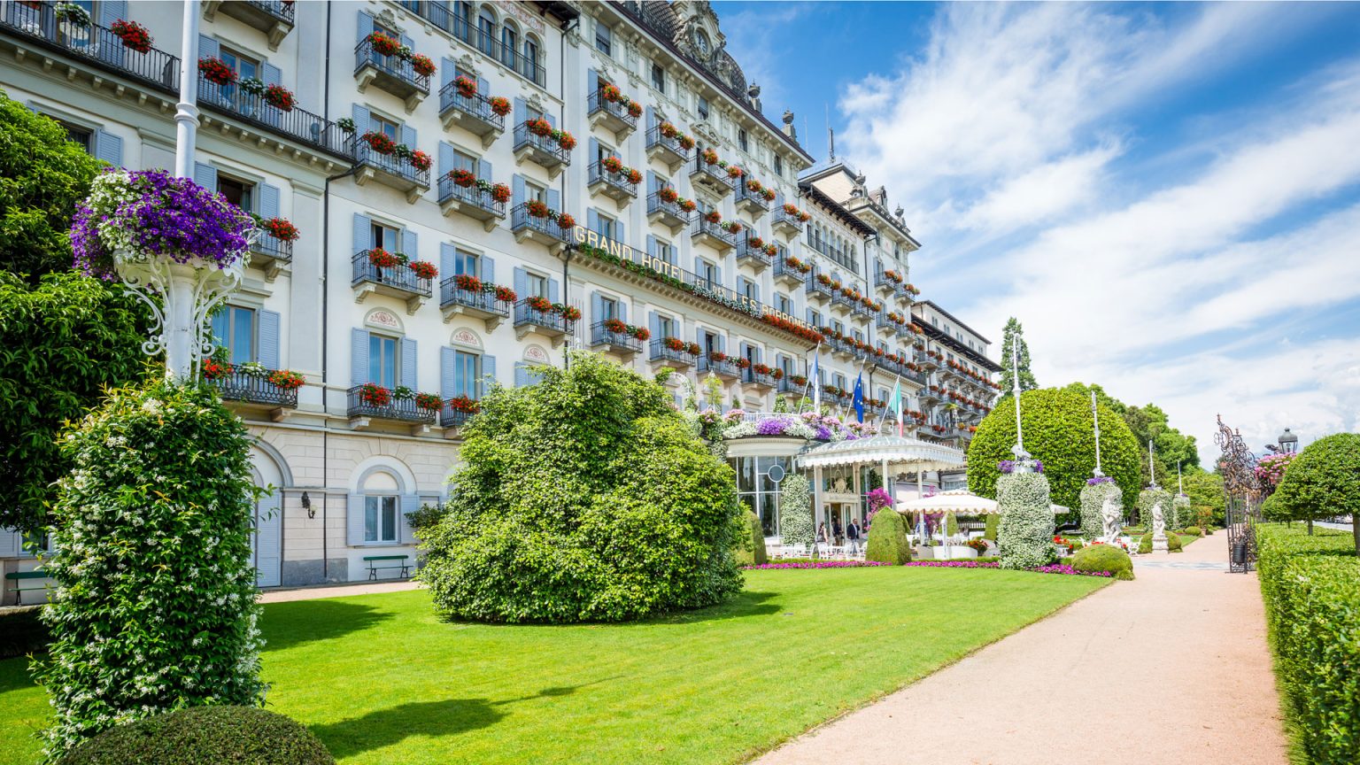The Belle Epoque garden facade of Grand Hotel des Iles Borromees in Stresa, with flower-box balconies and Italian gardens