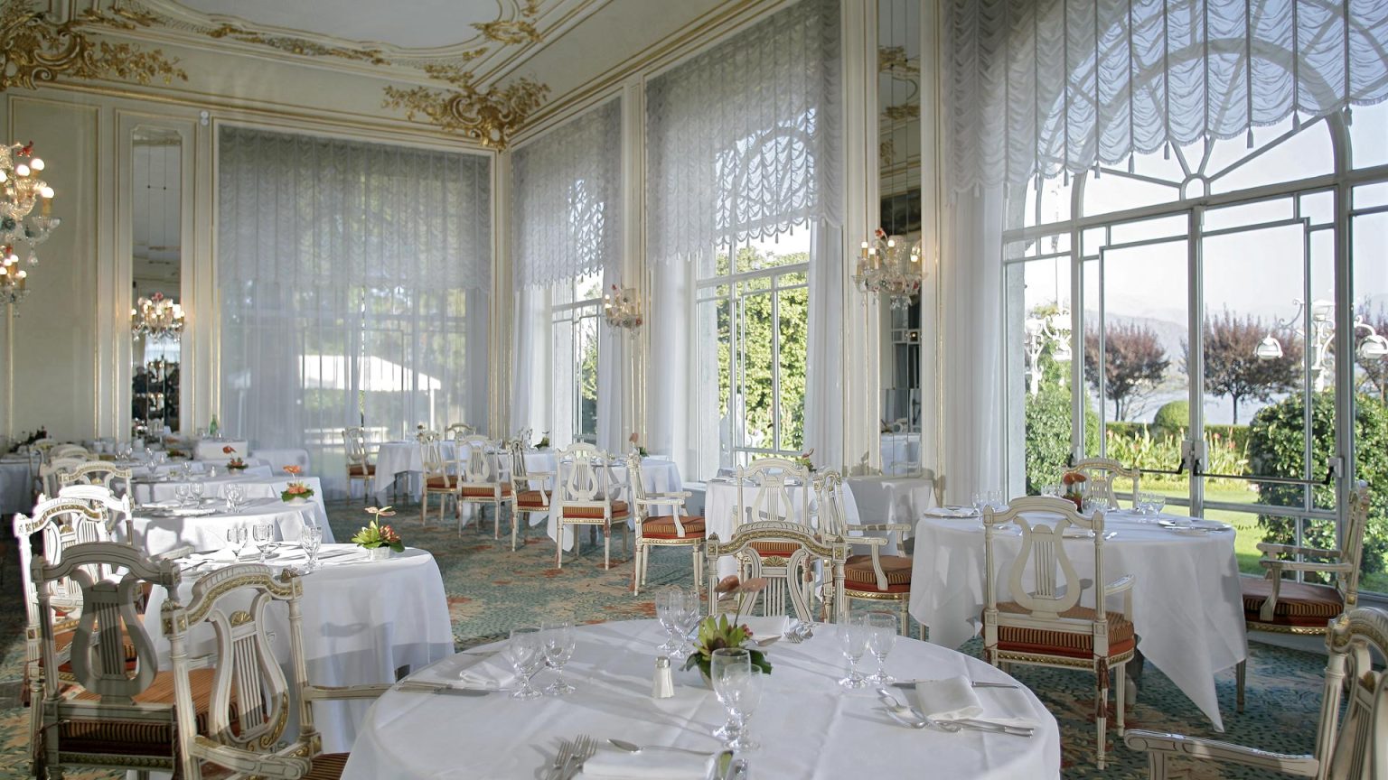 Ristorante Il Borromeo, a Belle Epoque dining room with lace-draped lake-view windows