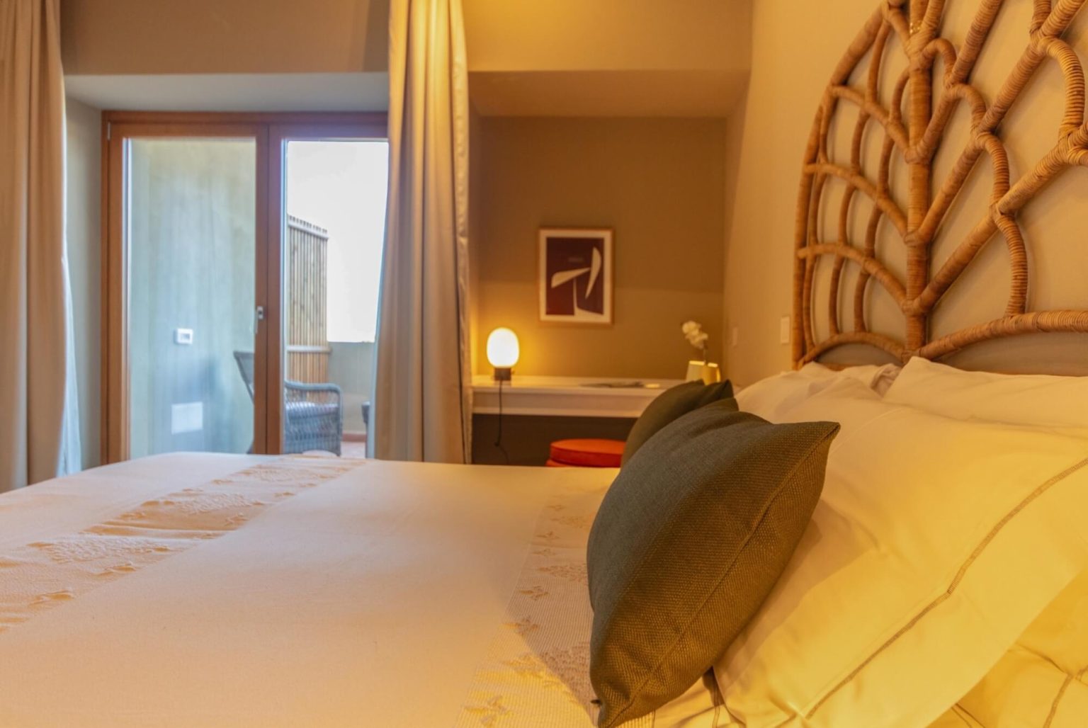 A deluxe room with balcony at Is Molas Resort
