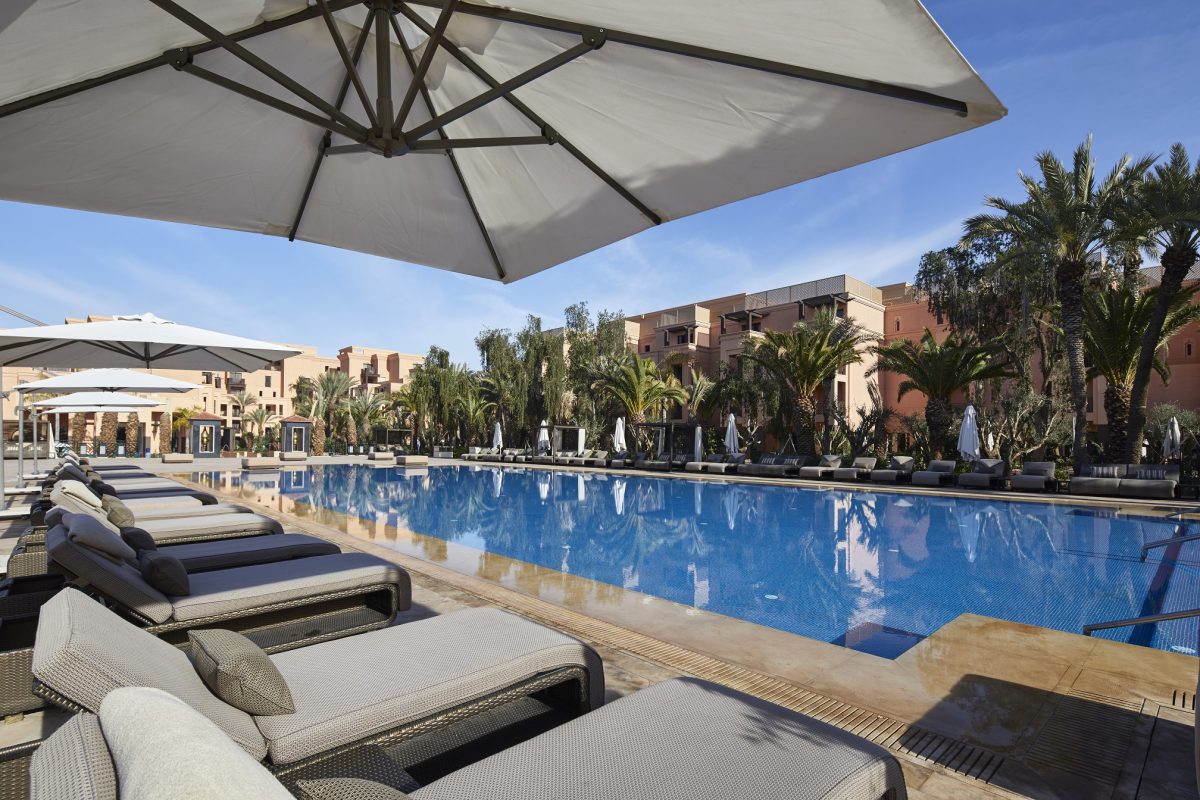 Apres golf by the pool at Mövenpick Hotel Mansour Eddahbi, Marrakech, Morocco.