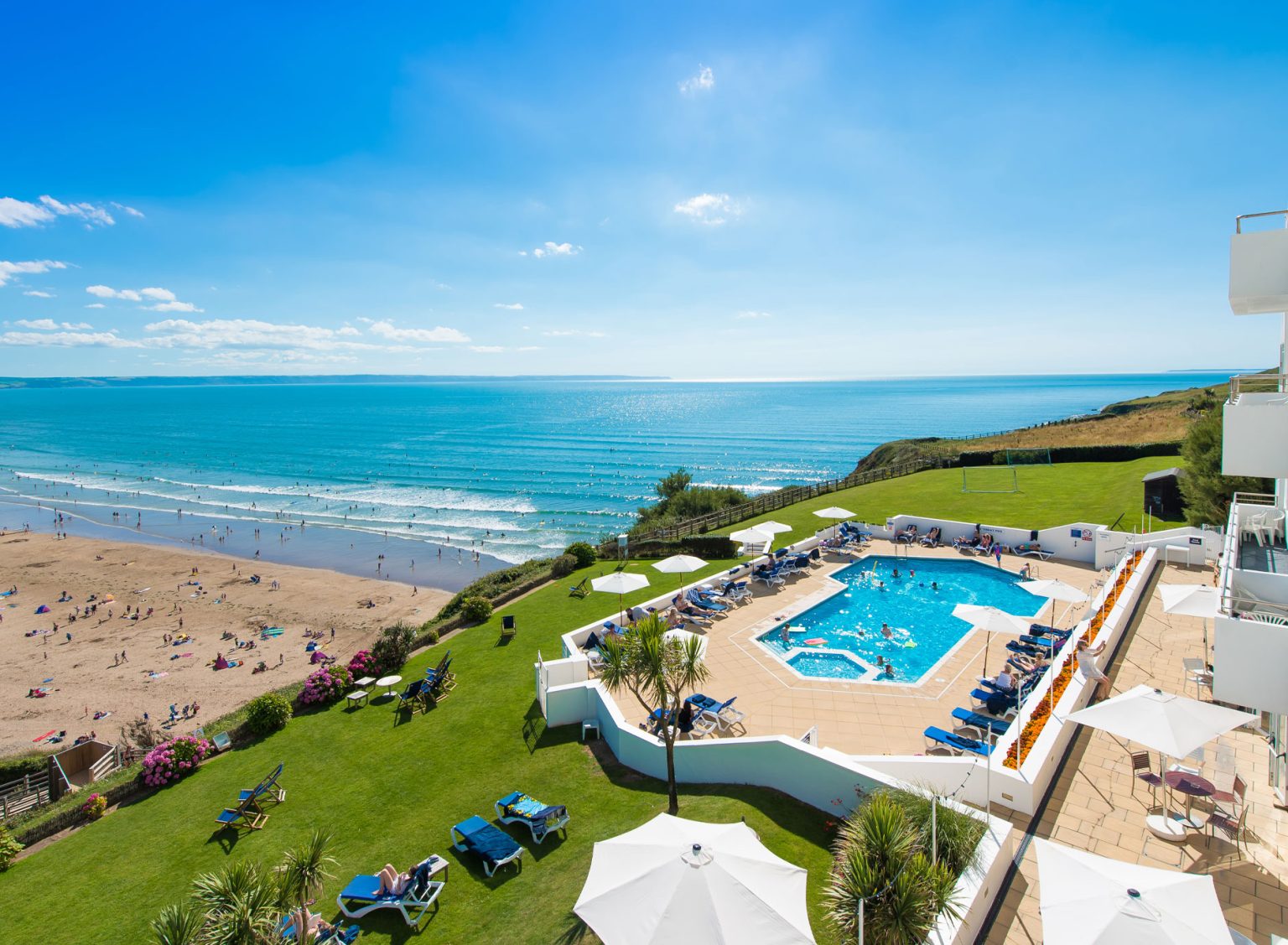 The outdoor pool, gardens and sea view from Saunton Sands Hotel