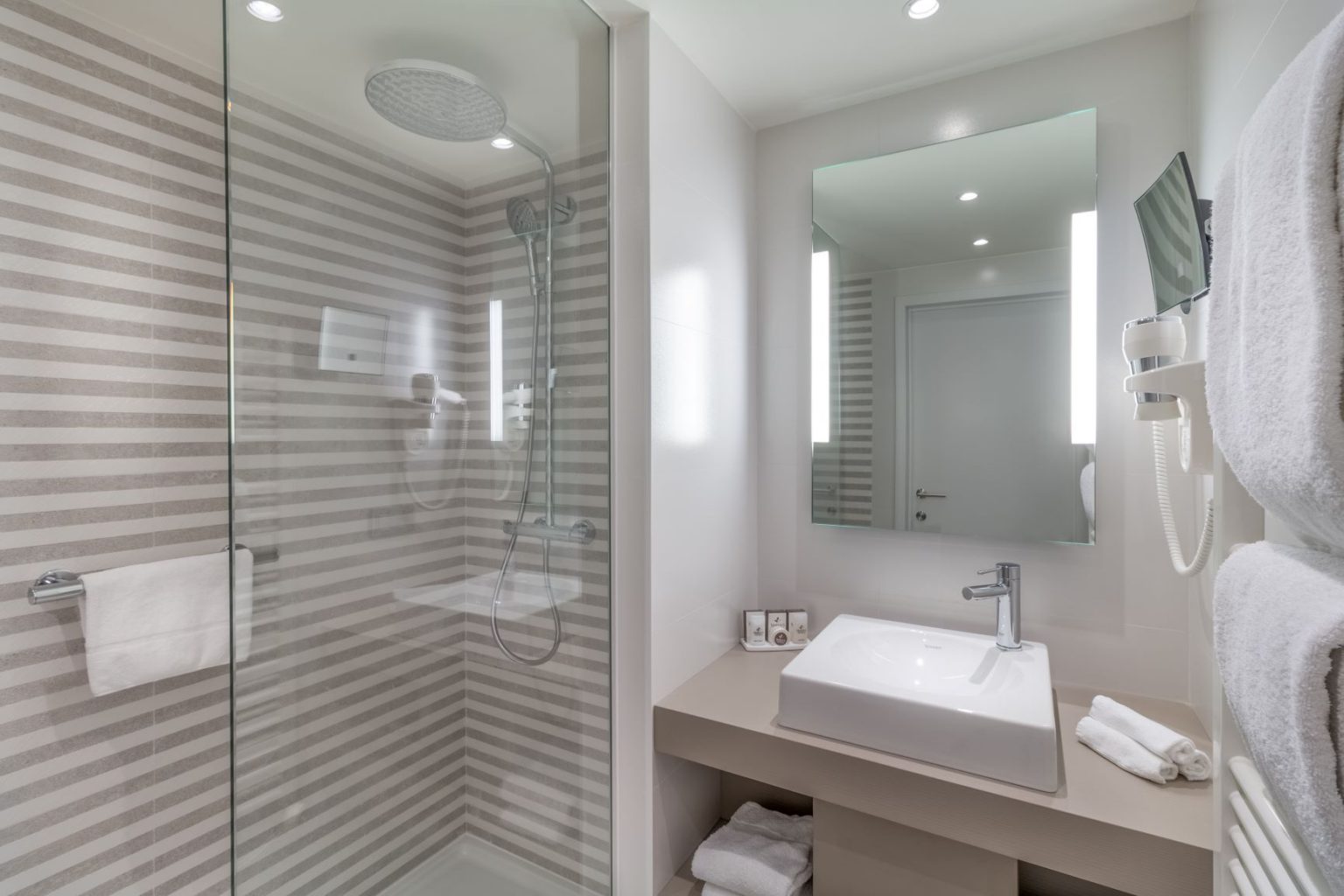 A large shower room at Martin's Chateau du Lac Hotel, Waterloo, Belgium