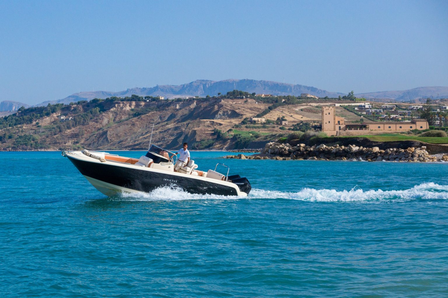 A boat on the Mediterranean off Verdura Resort's private shoreline
