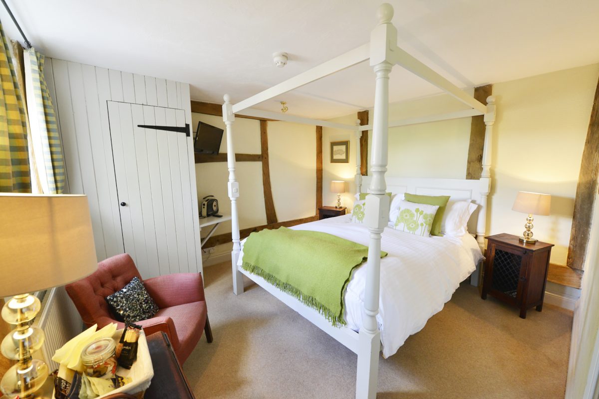 Four poster bedroom at The Grififn Inn, Fletching, England