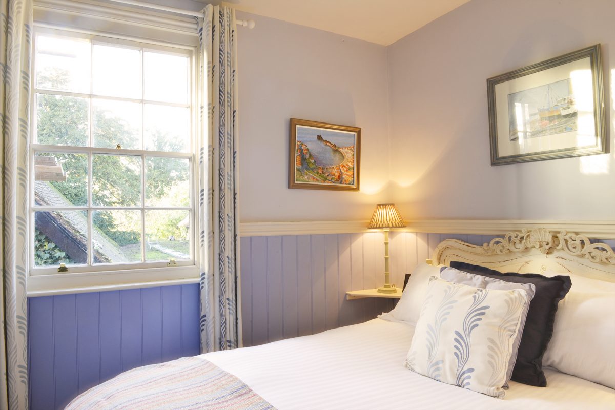 Lilac colours in a bedroom at The Griffin Inn, Fletching, England
