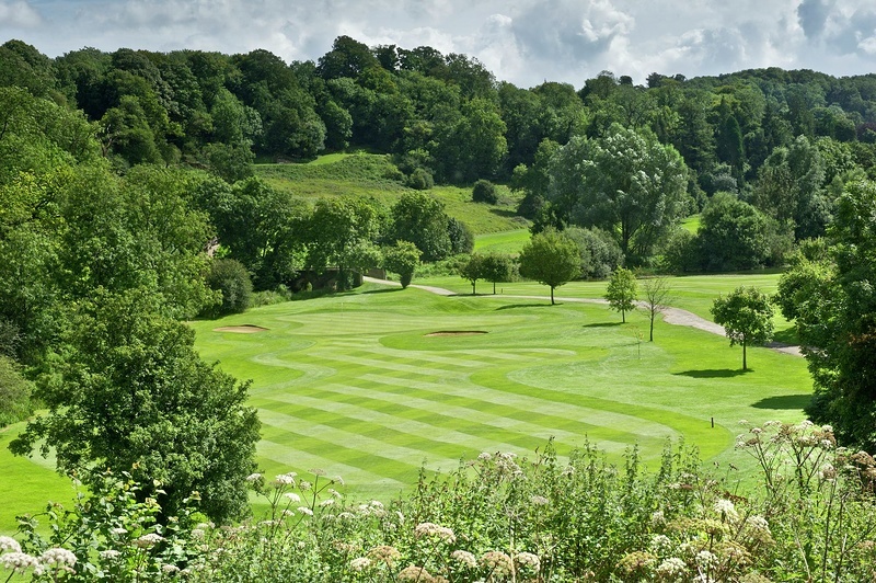 The 12th hole fairway and green at Manor House Golf Club, Castle Combe, Cotswolds, England