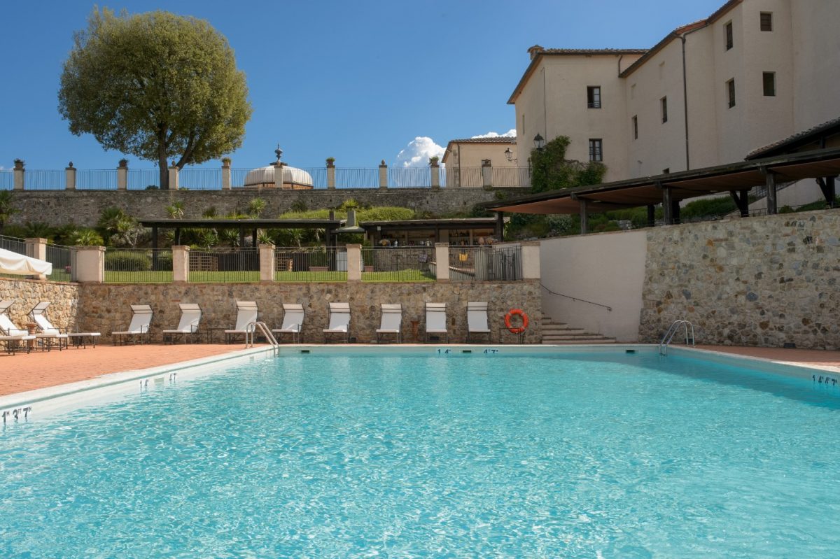 Clear skies and a sparkling swimming pool at La Bagnaia Golf and Spa Resort, Siena, Tuscany