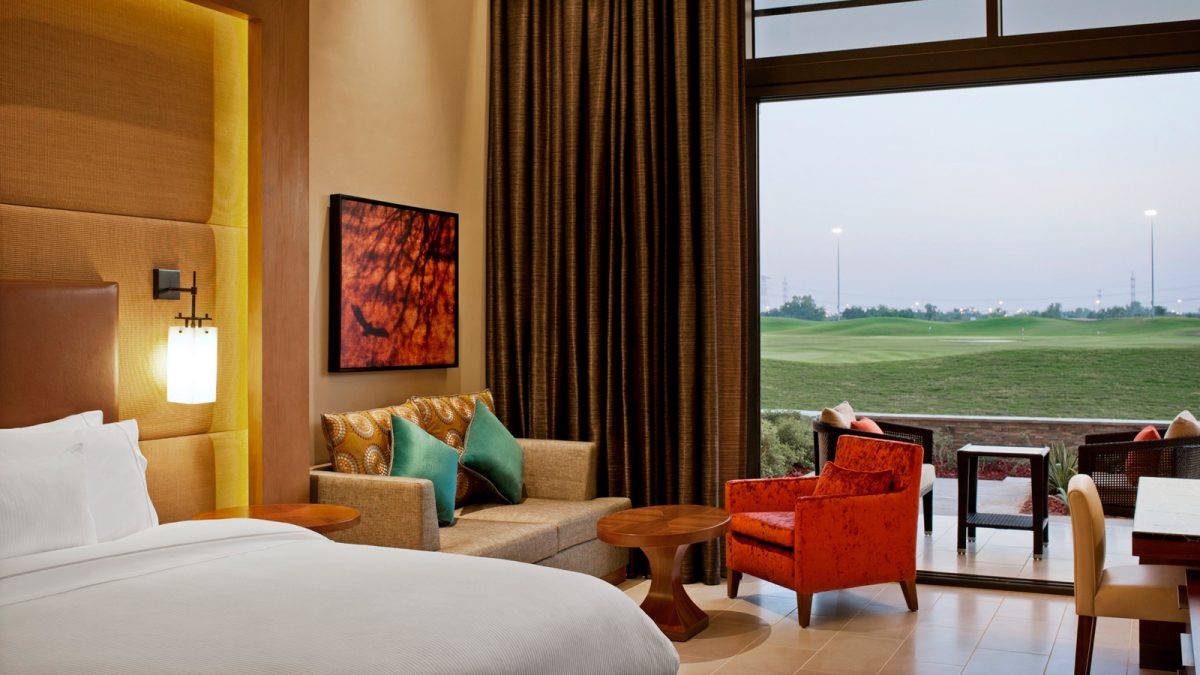 A deluxe bedroom overlooking the golf course at The Westin Resort Golf and Spa, Abu Dhabi