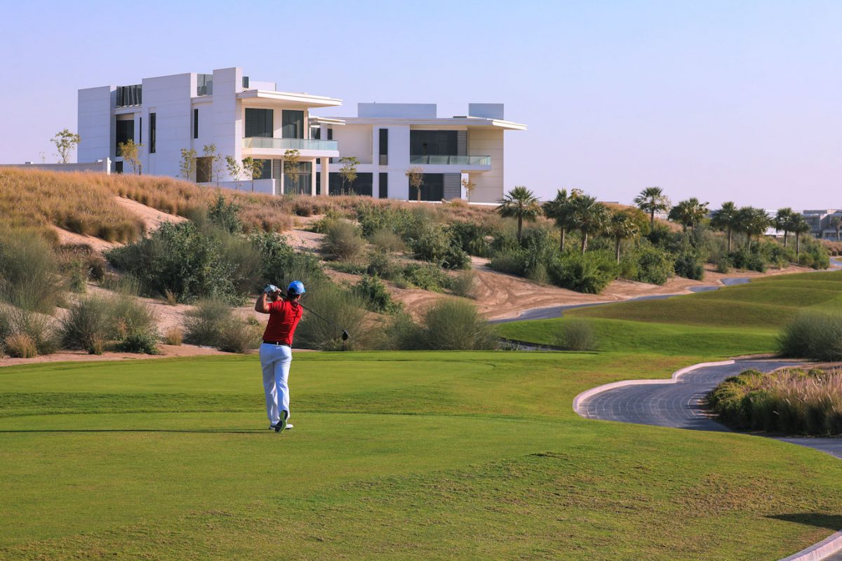 Driving down the fairway at Dubai Hills Golf Club
