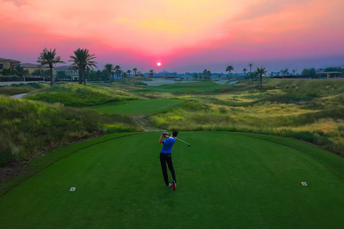 Playing towards the sinking sun at Saadiyat Beach Golf Club, Abu Dhabi