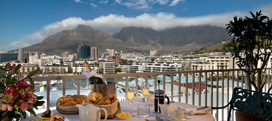 Breakfast on the balcony at The Commodore Hotel, Cape Town, South Africa. Golf Planet Holidays.