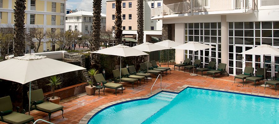 The outdoor swimming pool at The Commodore Hotel, Cape Town, South Africa. Golf Planet Holidays.
