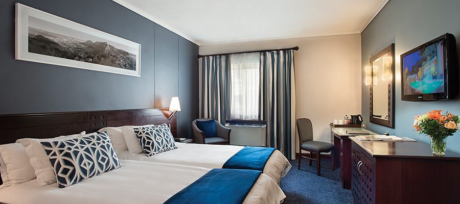 Double bedroom at The Commodore Hotel, Cape Town South Africa. Golf Planet Holidays.