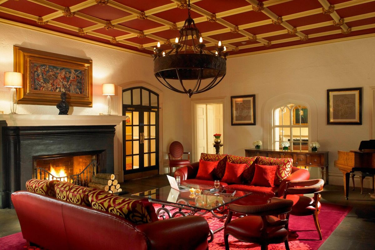 Sit by the fire in the lounge at St Pierre Marriott Hotel and Country Club, Chepstow