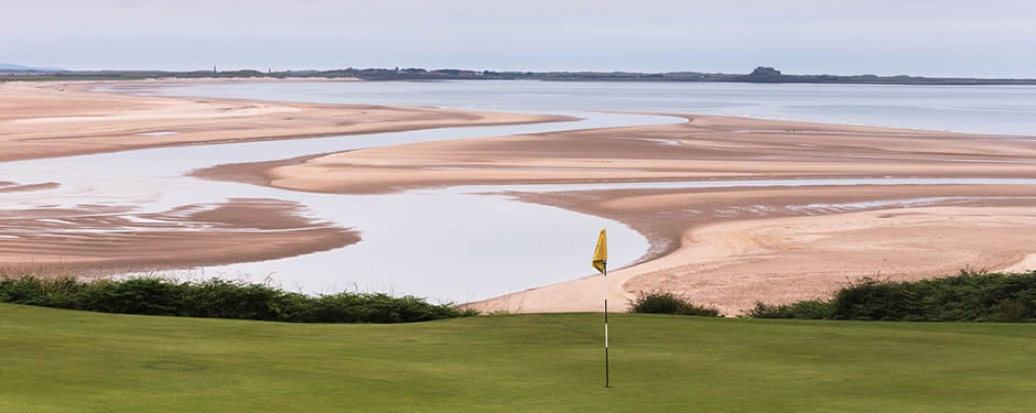 Tide is out at Bamburgh Castle Golf Club, Northumberland, England