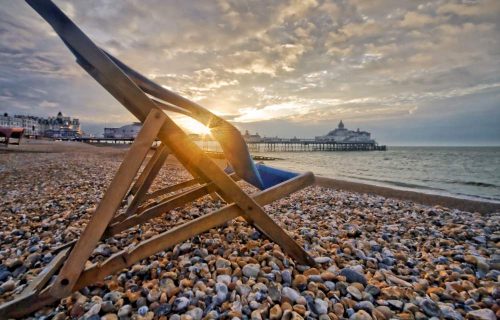 The pebble beach and Eastbourne pier a few steps from The Grand Hotel Eastbourne, England