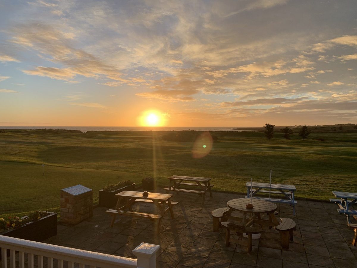Sunset over the sea at Seahouses Golf Club, Northumberland, England