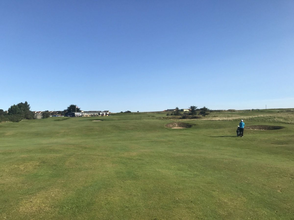Playing towards the clubhouse at Seahouses Golf Club, Northumberland, England