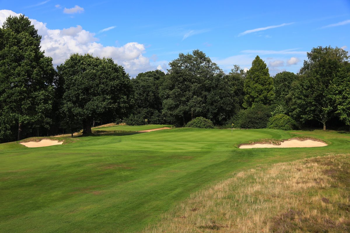 Trees surround the green at Stoneham Golf Club, Hampshire, England