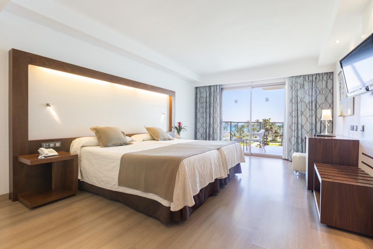 Stay in a luxury bedroom at Hipotels Cala Millor Park hotel