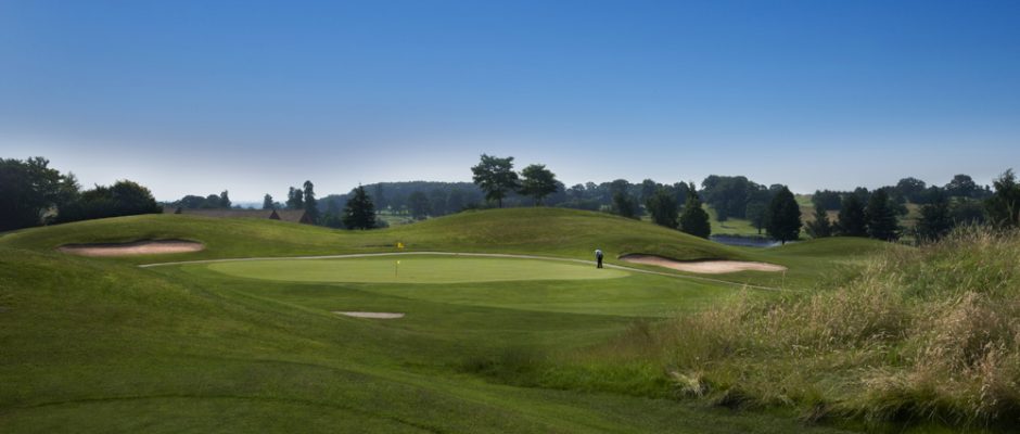 Putting to the flag on the King's Course at The Warwickshire Golf Club, England