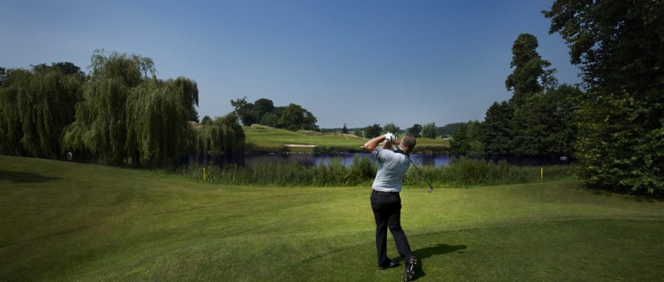 Driving over the water on the King's Course,The Warwickshire Golf Club, England