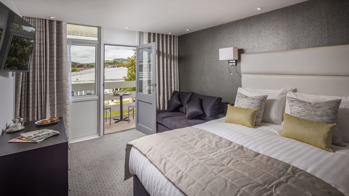 Relax in your comfortable bedroom with balcony in The Barnstaple Hotel Devon