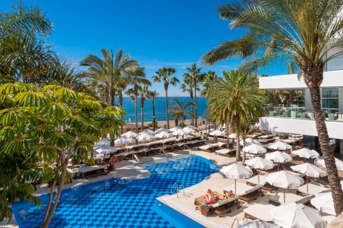 Sunshades for everyone by the pool at the Amare Beach Hotel Marbella, Costa del Sol, Spain