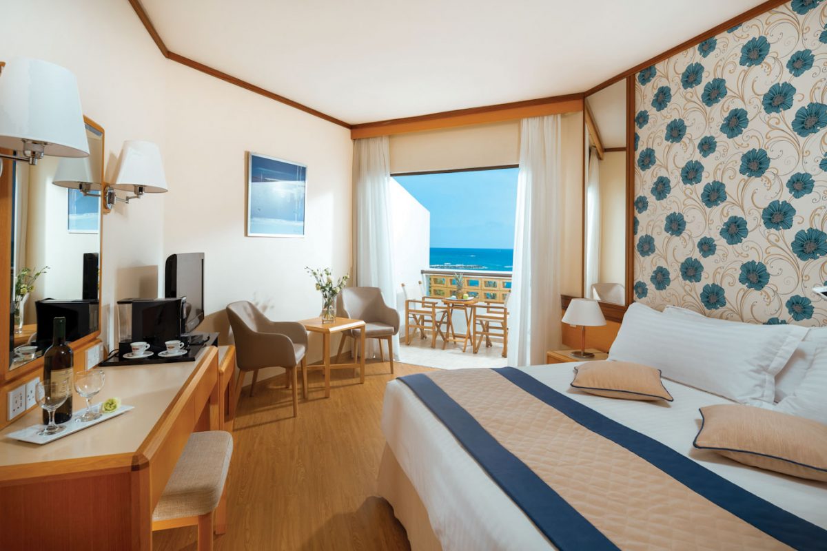 Bedroom with sea view at Constantinou Bros Athena Royal Beach Hotel Paphos