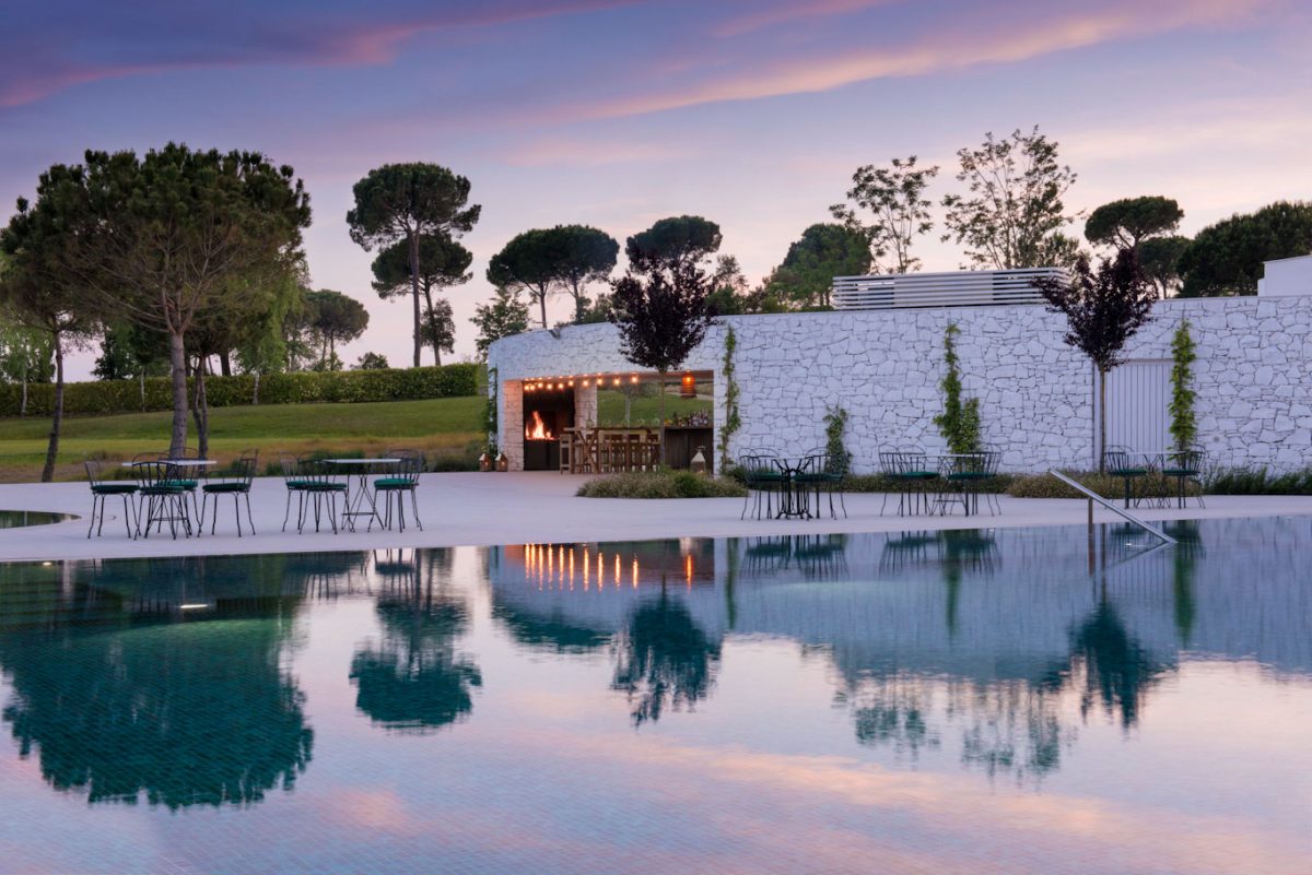 Sunset over the pool at Hotel Camiral PGA Catalunya Golf Resort, Costa Brava, Spain